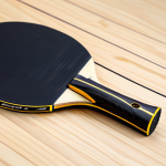 Professional Table Tennis Equipment Presentation**

"A close-up shot of a professionally arranged table tennis racket, showcasing the different layers of wood, carbon, rubber, and sponge, fully clothed, appropriate content, safe for work, studio lighting, perfect anatomy, natural proportions, professional product photography, high quality, modest."

**